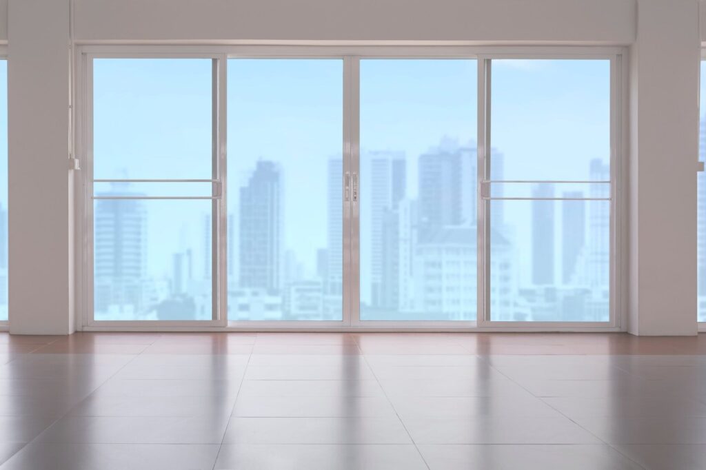 Glass sliding doors on tile floor in empty room